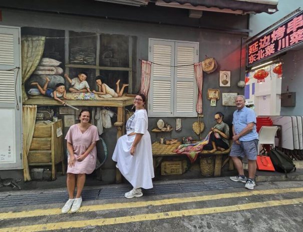 Travellers-interacting-with-street-art-on-Culture-Curious-Singapore-City-Tour.